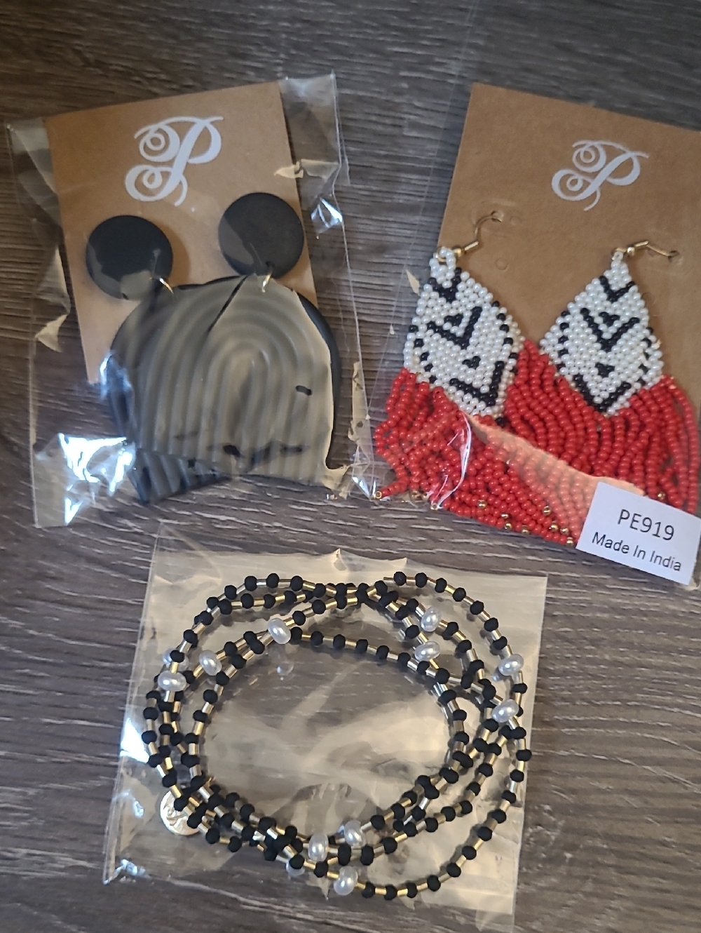 Plunder Earrings Two Pairs And 4 Stretchy Plunder Bracelets.